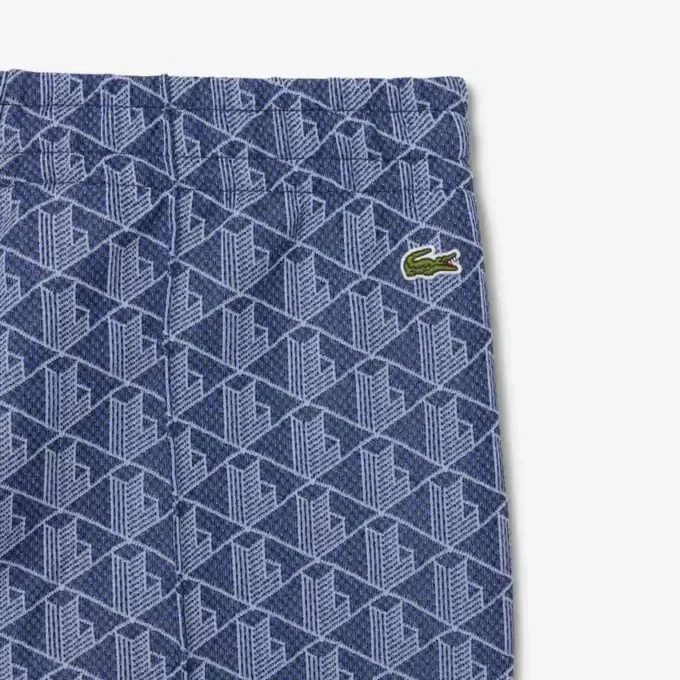 Dámské rozšiřující se tepláky s monogramem Dámské rozšiřující se tepláky s monogramem