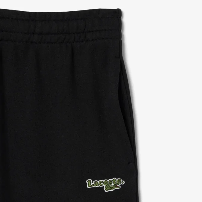Dámské tepláky s logem a rovným střihem Dámské tepláky s logem a rovným střihem