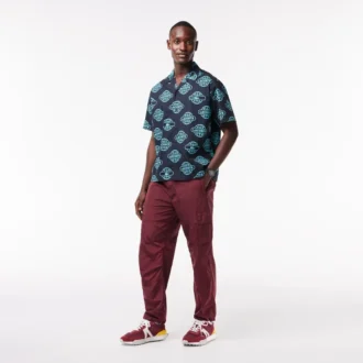 Hodinky Lacoste.12.12 Chrono, černé a karneválově zlaté, silikonové