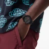 Hodinky Lacoste.12.12 Chrono, černé a karneválově zlaté, silikonové