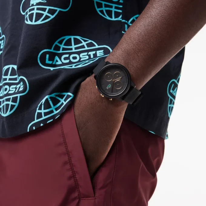 Hodinky Lacoste.12.12 Chrono, černé a karneválově zlaté, silikonové