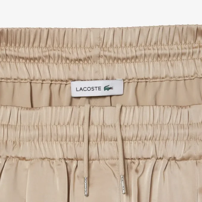 Oversized saténové kalhoty s elastickým pasem Oversized saténové kalhoty s elastickým pasem