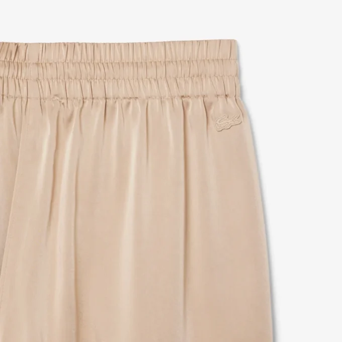 Oversized saténové kalhoty s elastickým pasem Oversized saténové kalhoty s elastickým pasem