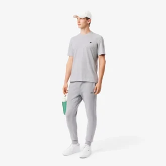 Pánské tepláky ze strečového úpletu se slim fit střihem