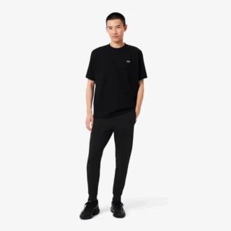 Pánské tepláky ze strečového úpletu se slim fit střihem