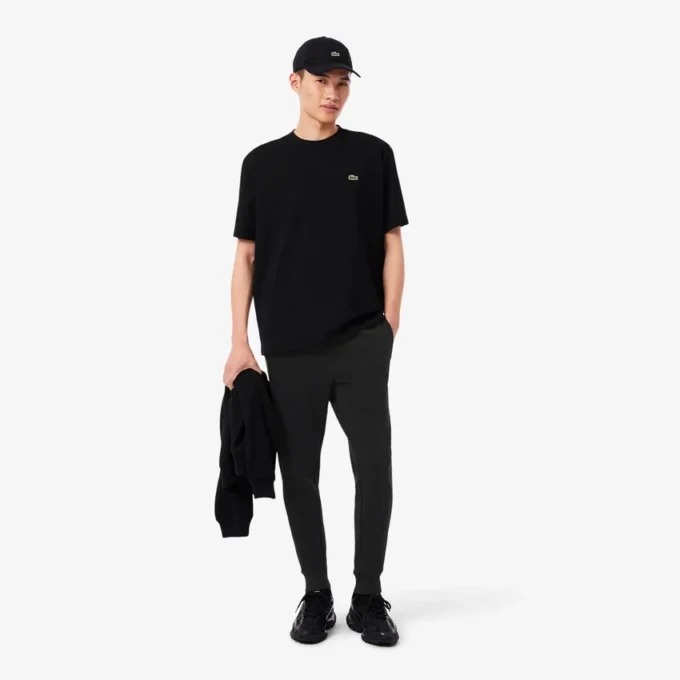 Pánské tepláky ze strečového úpletu se slim fit střihem Pánské tepláky ze strečového úpletu se slim fit střihem