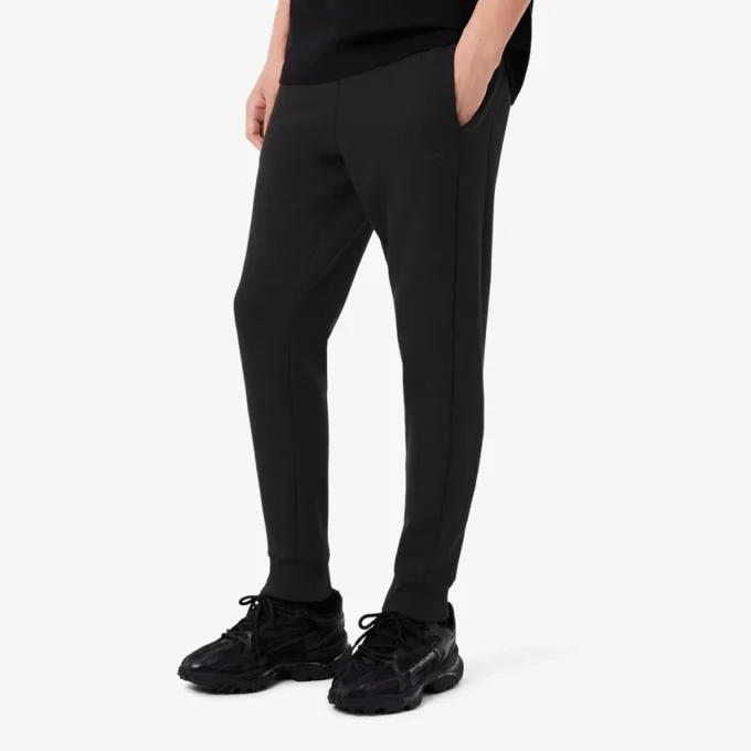 Pánské tepláky ze strečového úpletu se slim fit střihem Pánské tepláky ze strečového úpletu se slim fit střihem