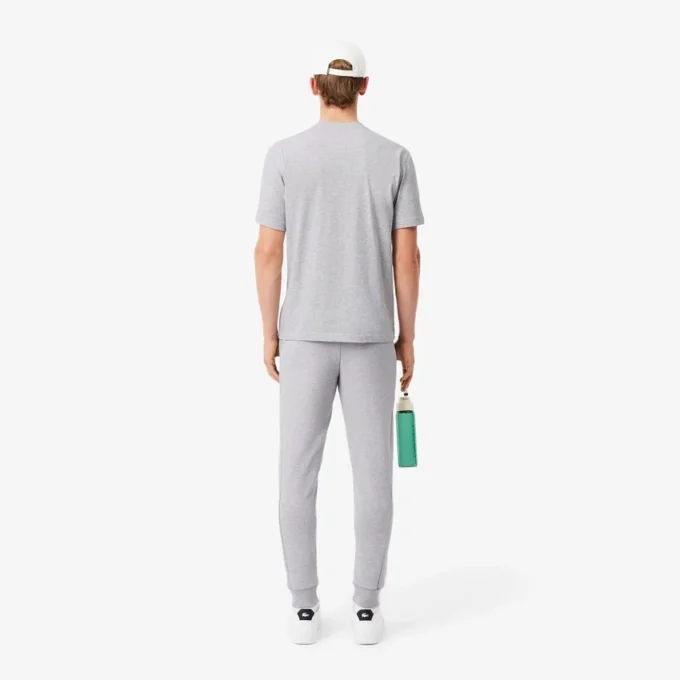 Pánské tepláky ze strečového úpletu se slim fit střihem Pánské tepláky ze strečového úpletu se slim fit střihem
