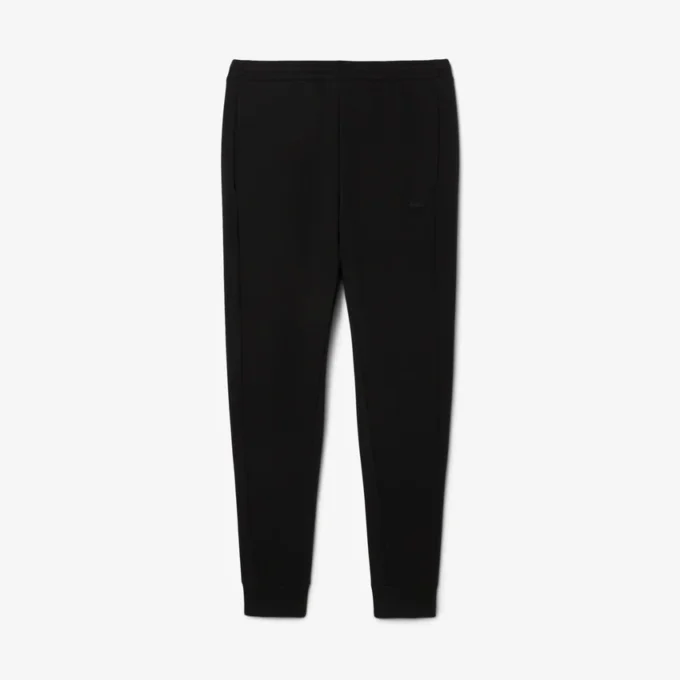 Pánské tepláky ze strečového úpletu se slim fit střihem Pánské tepláky ze strečového úpletu se slim fit střihem