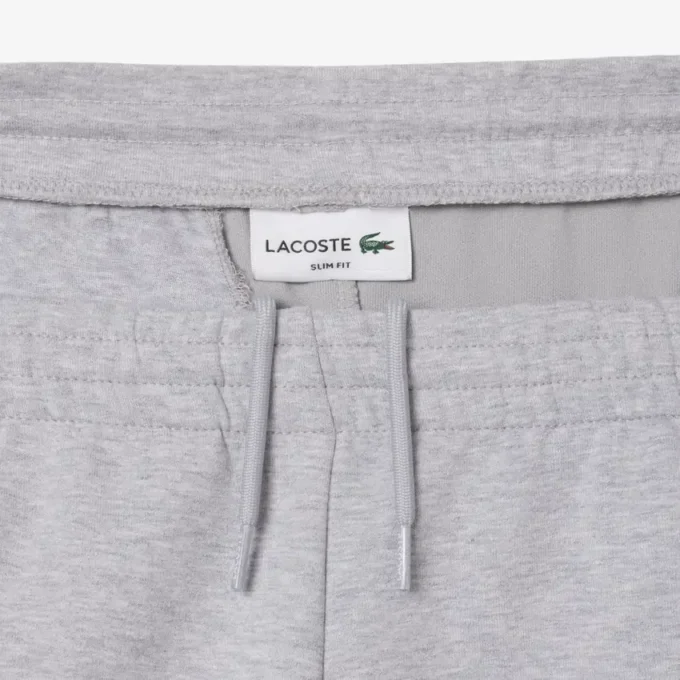 Pánské tepláky ze strečového úpletu se slim fit střihem Pánské tepláky ze strečového úpletu se slim fit střihem