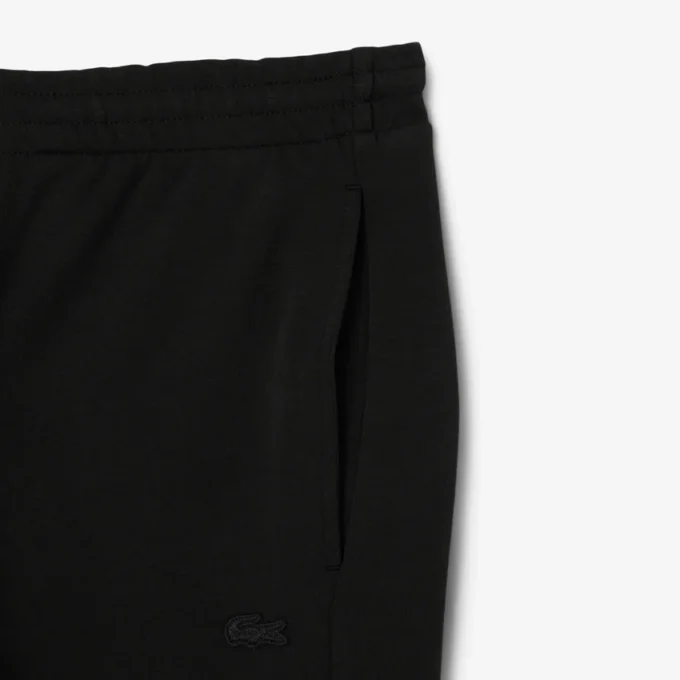 Pánské tepláky ze strečového úpletu se slim fit střihem Pánské tepláky ze strečového úpletu se slim fit střihem
