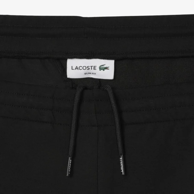 Pánské tepláky ze strečového úpletu se slim fit střihem Pánské tepláky ze strečového úpletu se slim fit střihem