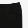 Pánské tepláky ze strečového úpletu se slim fit střihem Pánské tepláky ze strečového úpletu se slim fit střihem